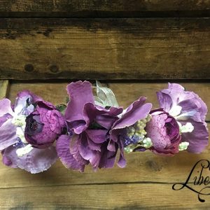 Corona de flores malva